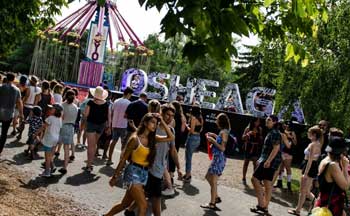 Crowd at Osheaga Music Festival in front of sign 