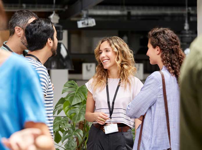 a group of people in a conference event setting networking 