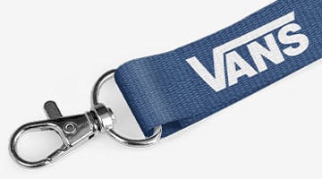 a screen printed lanyard in blue with Vans logo 