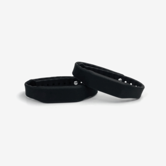 Two black adjustable silicone RFID wristbands, shown overlapping on a clean white background, featuring snap-style fasteners.