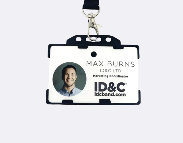 Rigid open-faced ID card holder with a visible photo ID clipped to a black lanyard, showing a secure and professional badge display