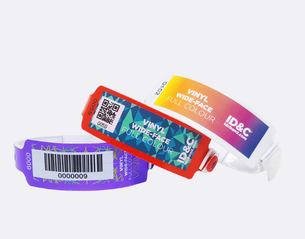 Three vinyl wristbands in purple, red, and gradient colours with barcodes and tags, showing durable options for multi-day events with moderate pricing